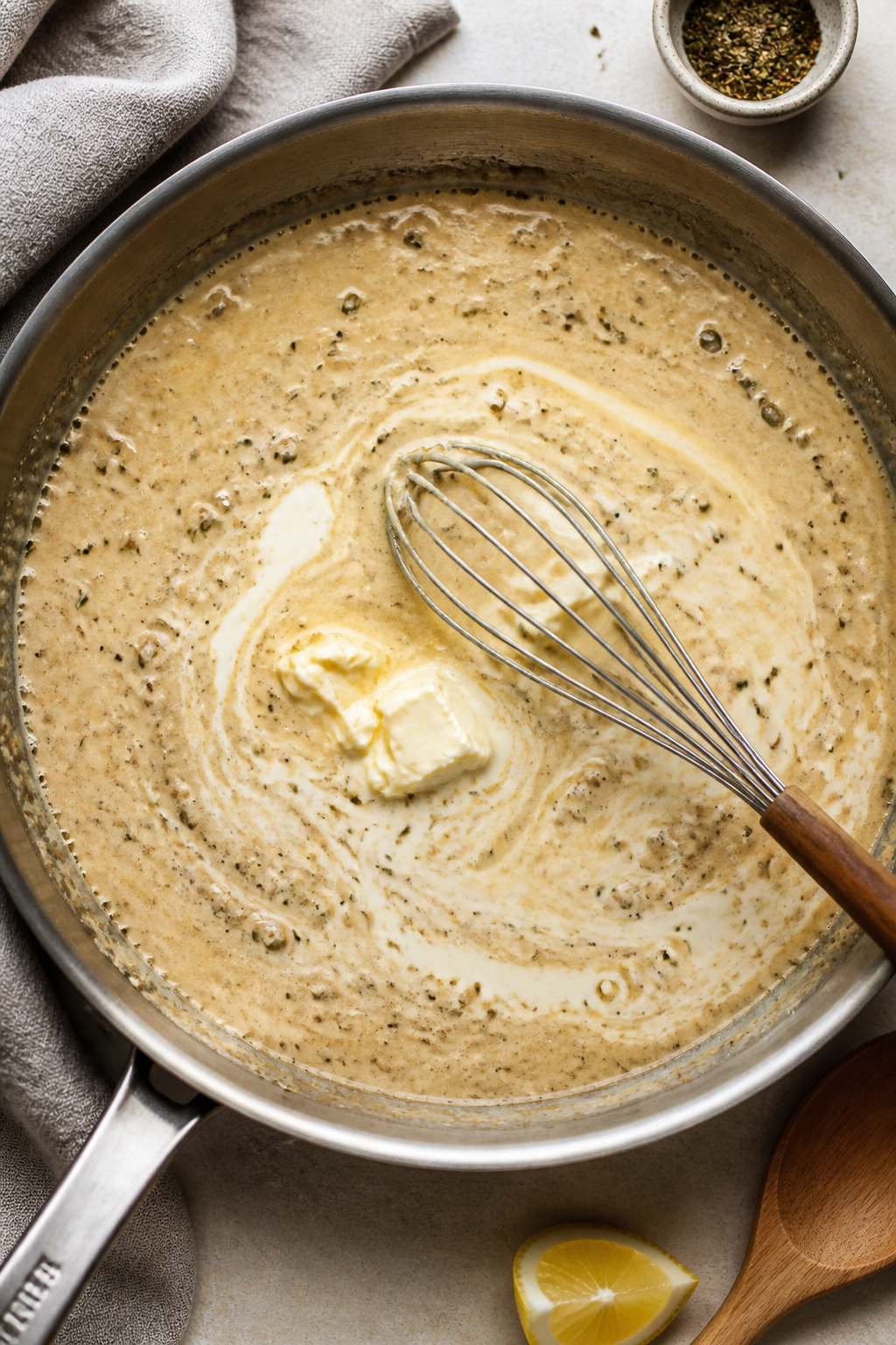 Sauce-making action shot: Overhead view of the skillet as butter-melted, garlic-studded creamy pan s