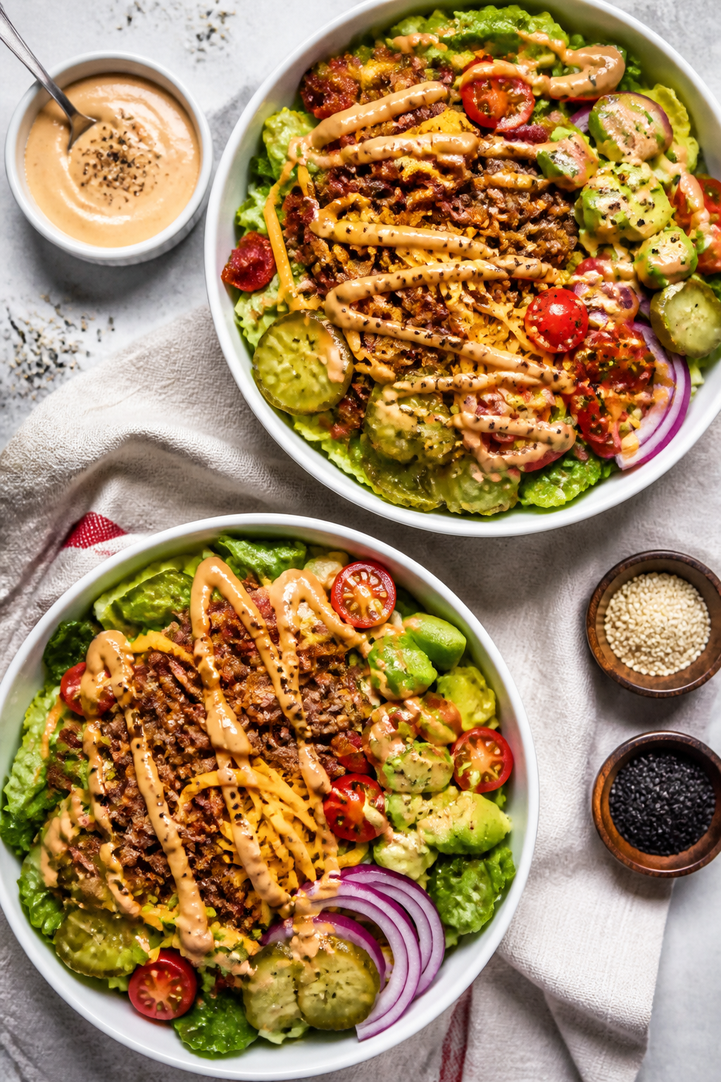 Tasty top view: Overhead shot of Keto Loaded Bacon Cheeseburger Bowls assembled for meal prep—cris